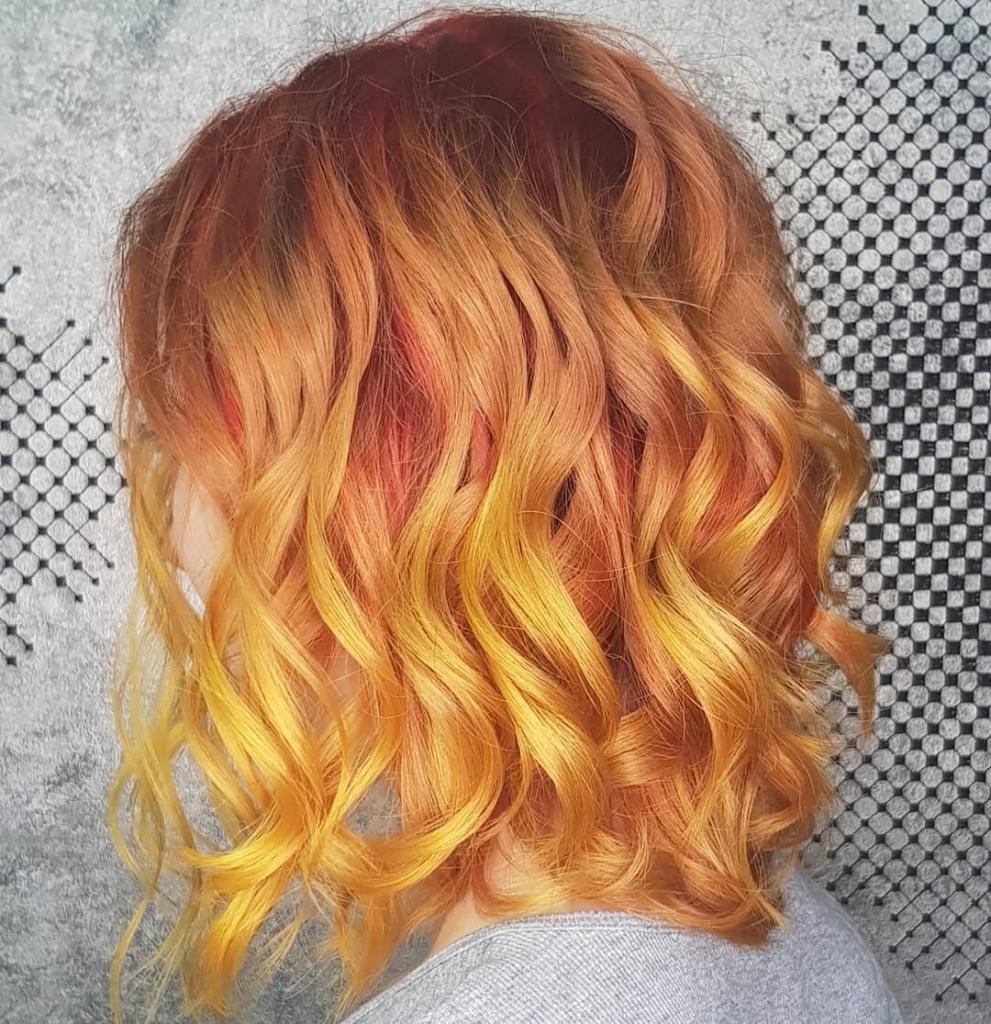 Chatouche su capelli rossi con tonalità dal giallo all'arancione